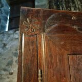French oak armoire, late 17th - early 18th century, Louis XIV provincial style with hand-carved rosettes