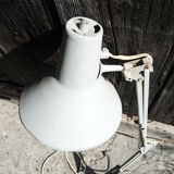 Old articulated workshop lamp in painted metal