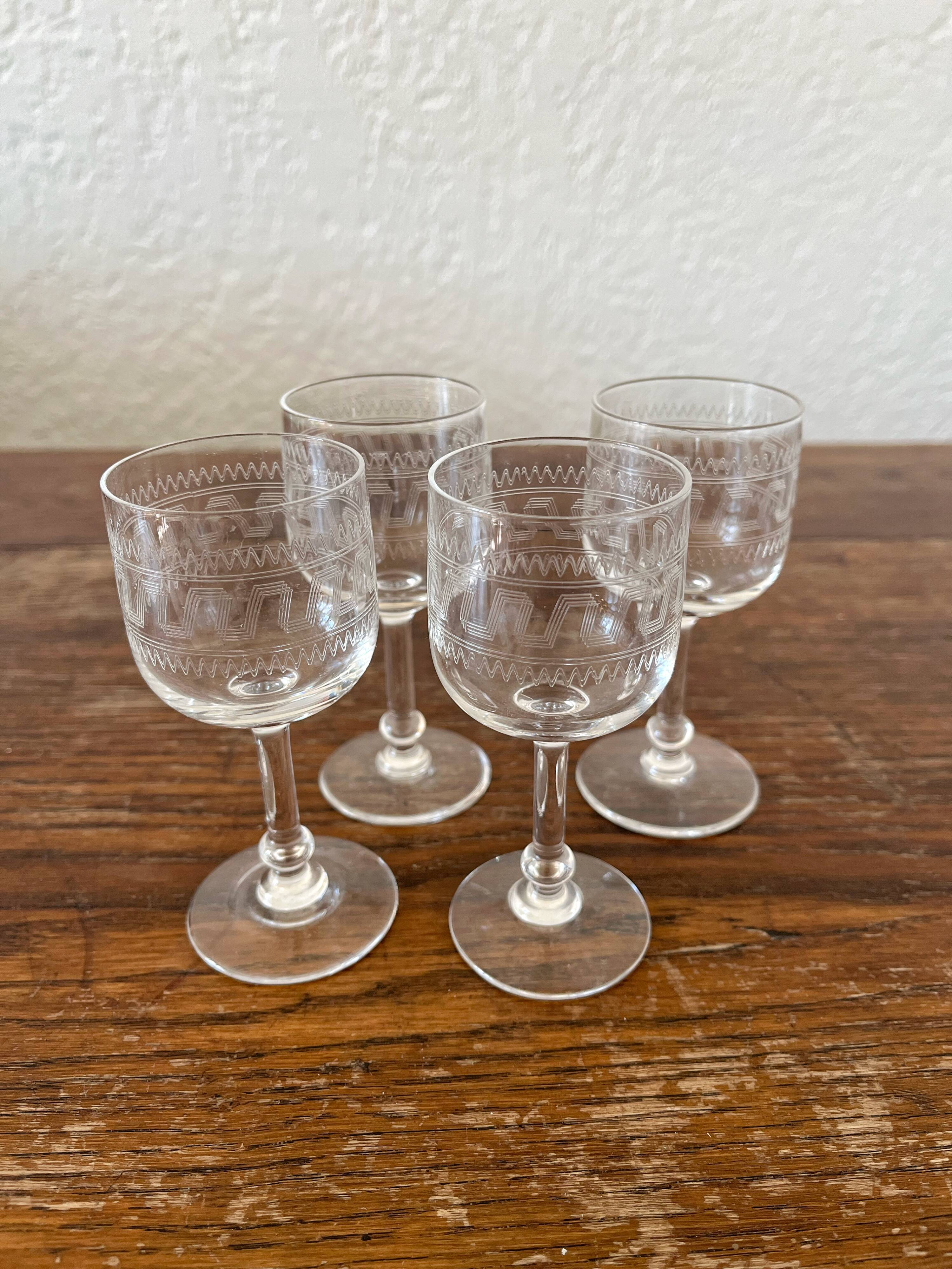 Four antique stemmed liqueur glasses in engraved crystal, 19th century