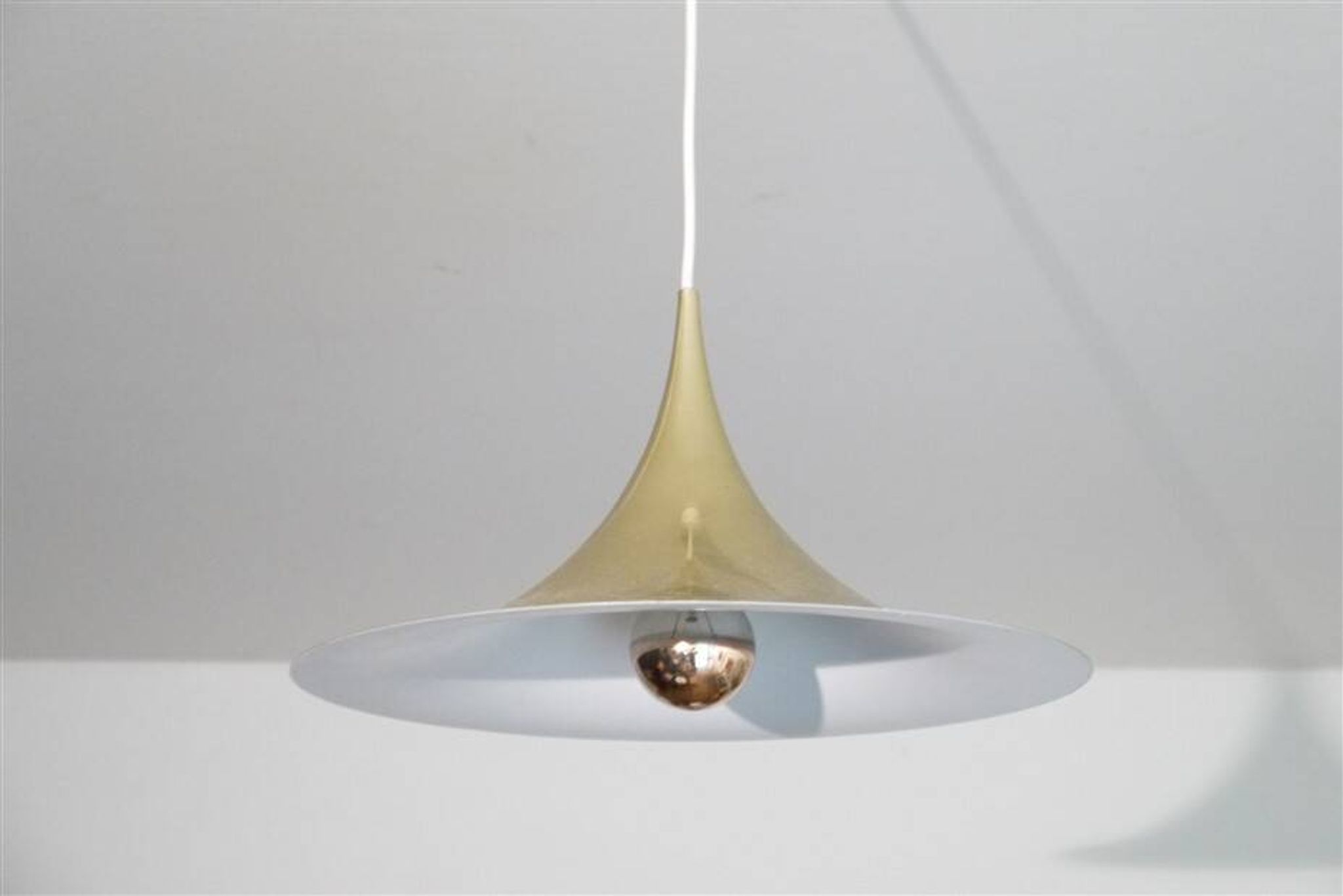 Semi pendulum pendant lamp by Thorup and Bonderup in brass