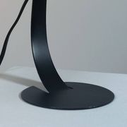 A pair of well-designed minimalist bedside lamps.
