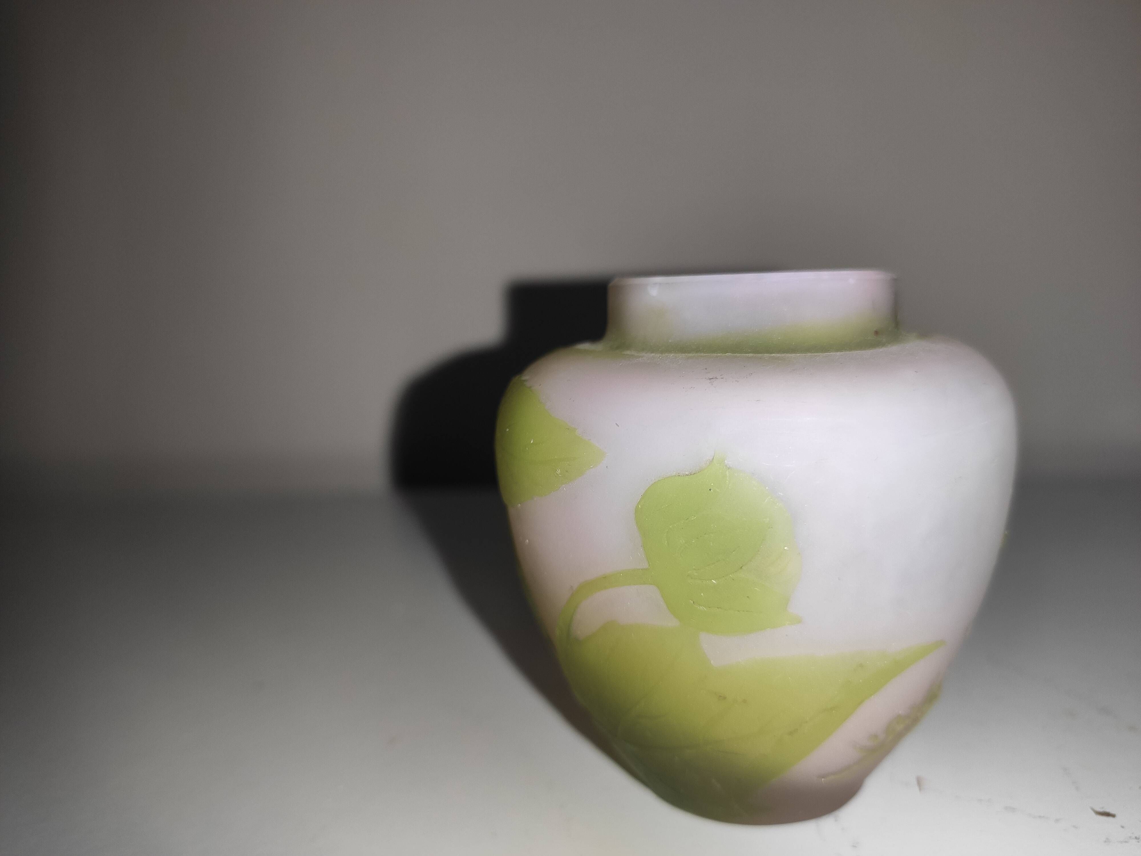 Small E. Gallé vase, "star" signature, light green tone on white background.
