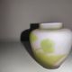Small E. Gallé vase, "star" signature, light green tone on white background.
