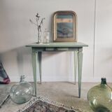 Green side table with tapered legs