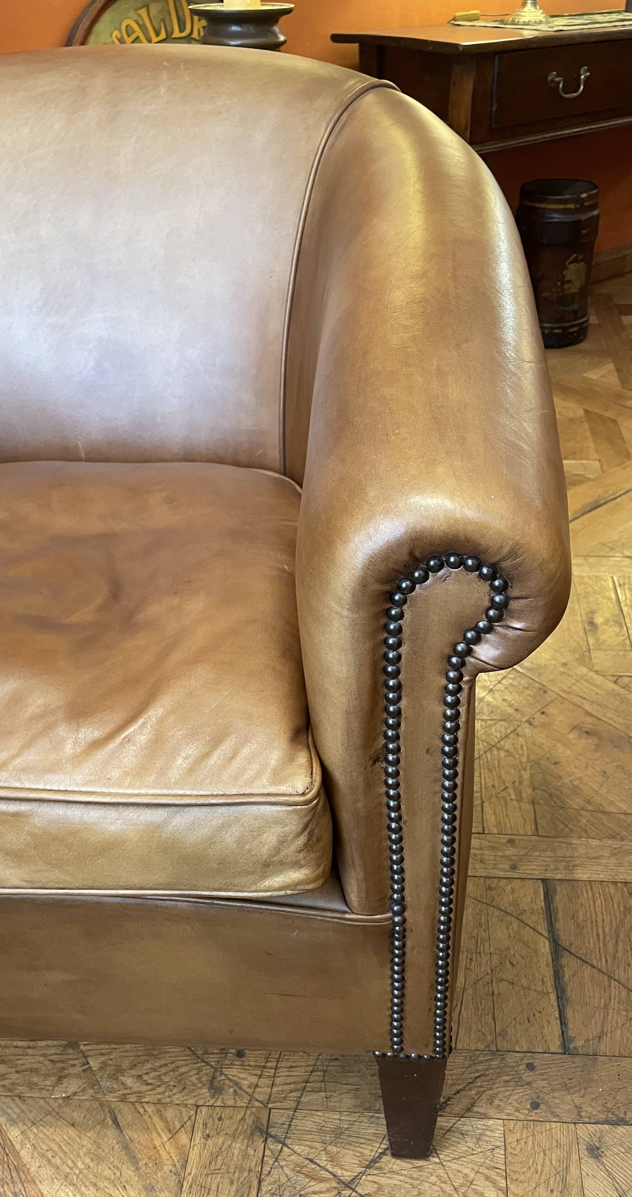 pair of camel leather club armchairs