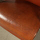 Pair of sculptural cognac leather armchairs, 1970s
