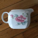 Vintage porcelain coffee or teapot with milk jug