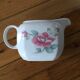Vintage porcelain coffee or teapot with milk jug