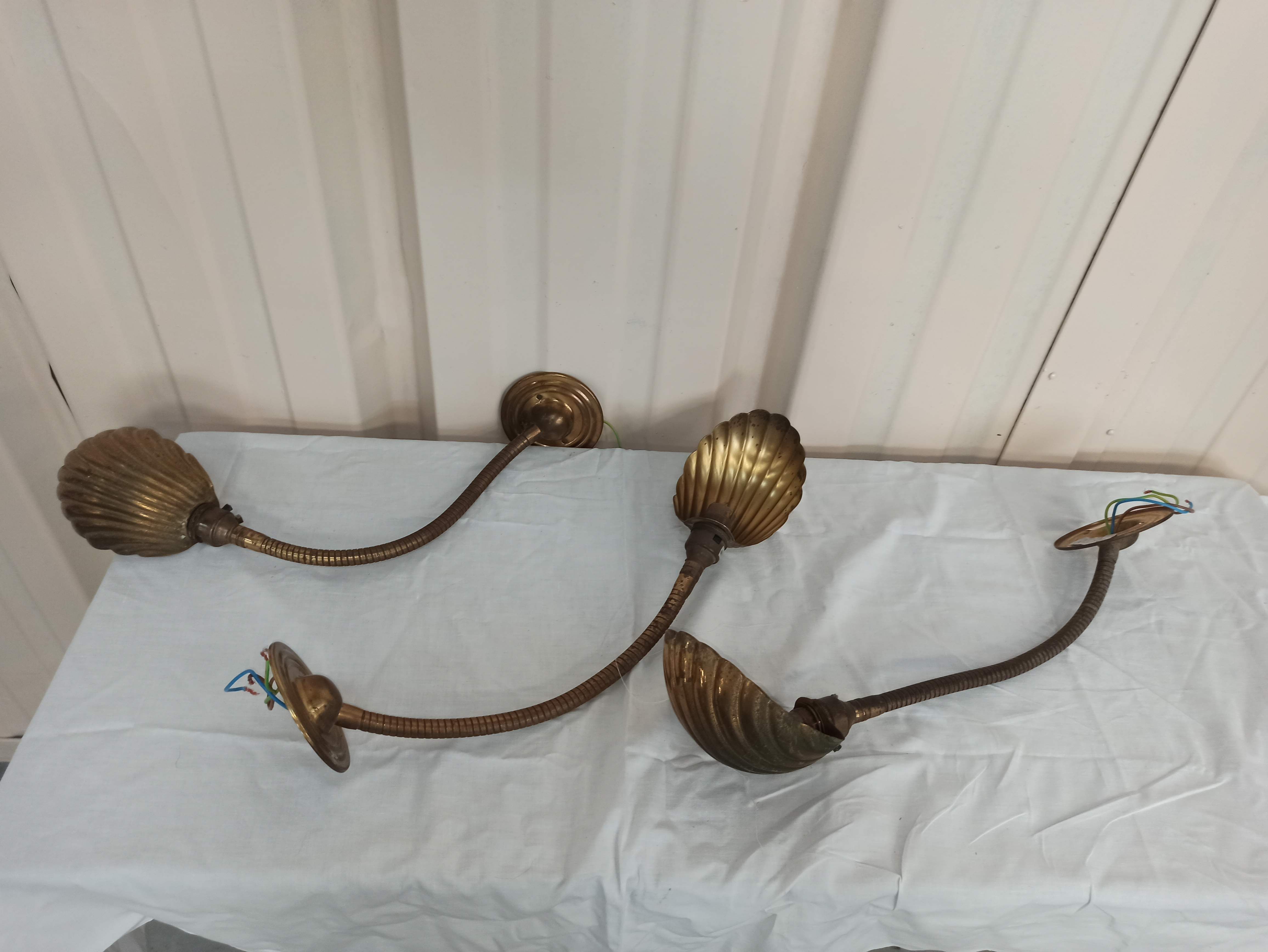 Trio of wall lamps Christopher Wray applies articulated lamp shell