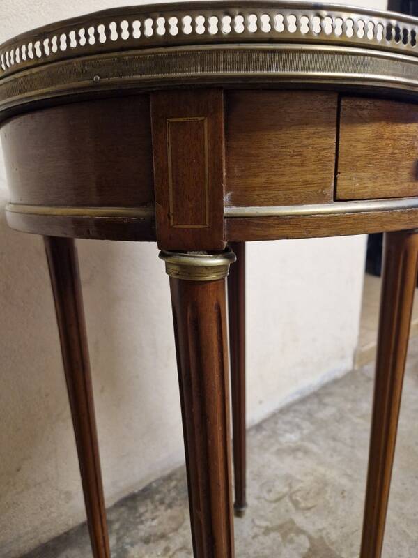 Louis XVI style bouillotte table in mahogany with a grey marble top.