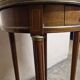 Louis XVI style bouillotte table in mahogany with a grey marble top.