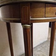 Louis XVI style bouillotte table in mahogany with a grey marble top.
