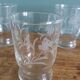 Old digestif or liqueur glasses, handcrafted glass with a floral pattern.
