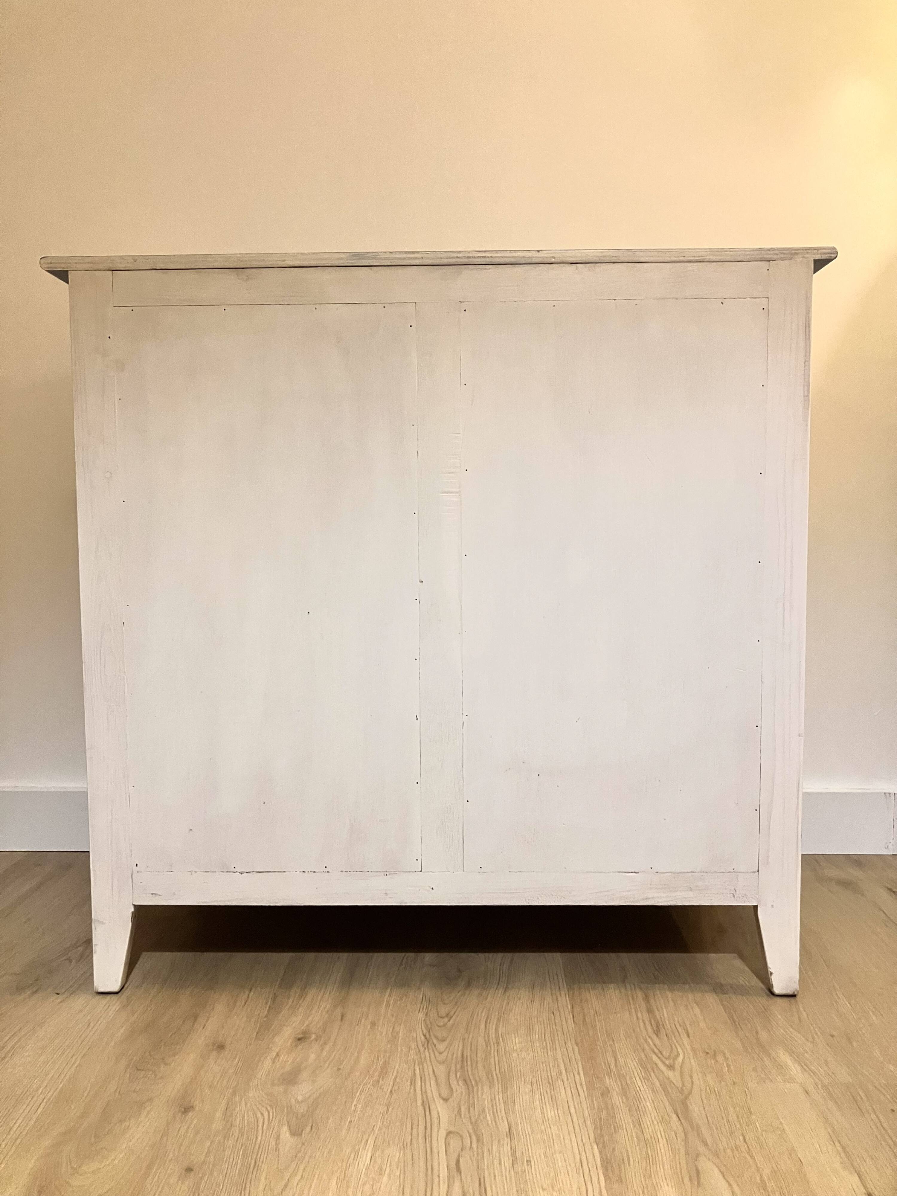 Wooden chest of drawers with tapered legs