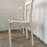 Set of 6 mismatched white chairs