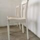 Set of 6 mismatched white chairs