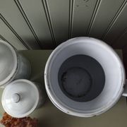Rare large, pot-bellied toilet jug in white enamelled sheet metal with gold edging