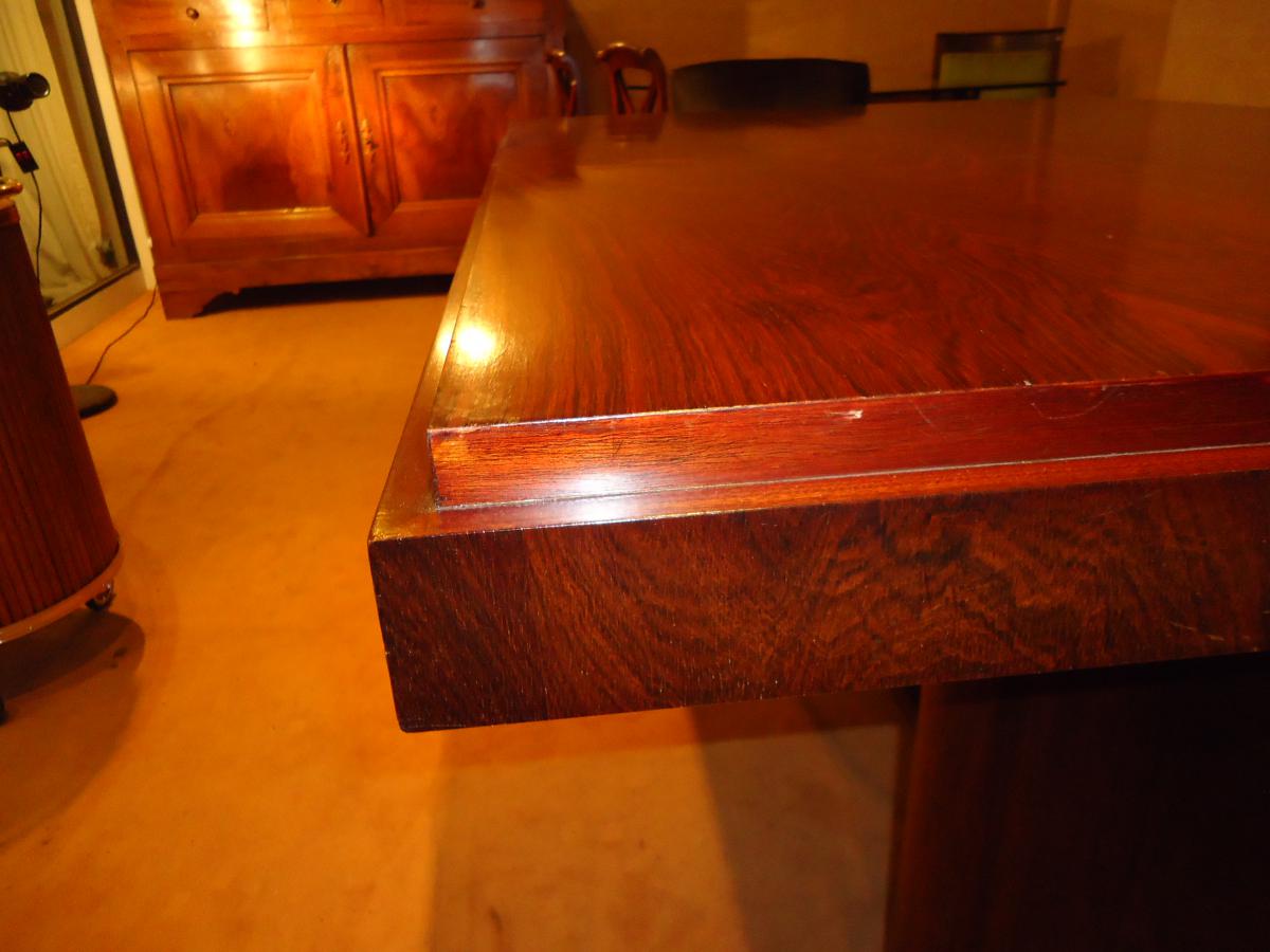 Modernist dining table in rosewood veneer.