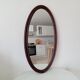 Oval antique mirror in solid wood from the 1960s.