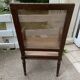 Wooden armchair with caning in Louis XVI style