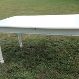 White farmhouse table set and four chairs