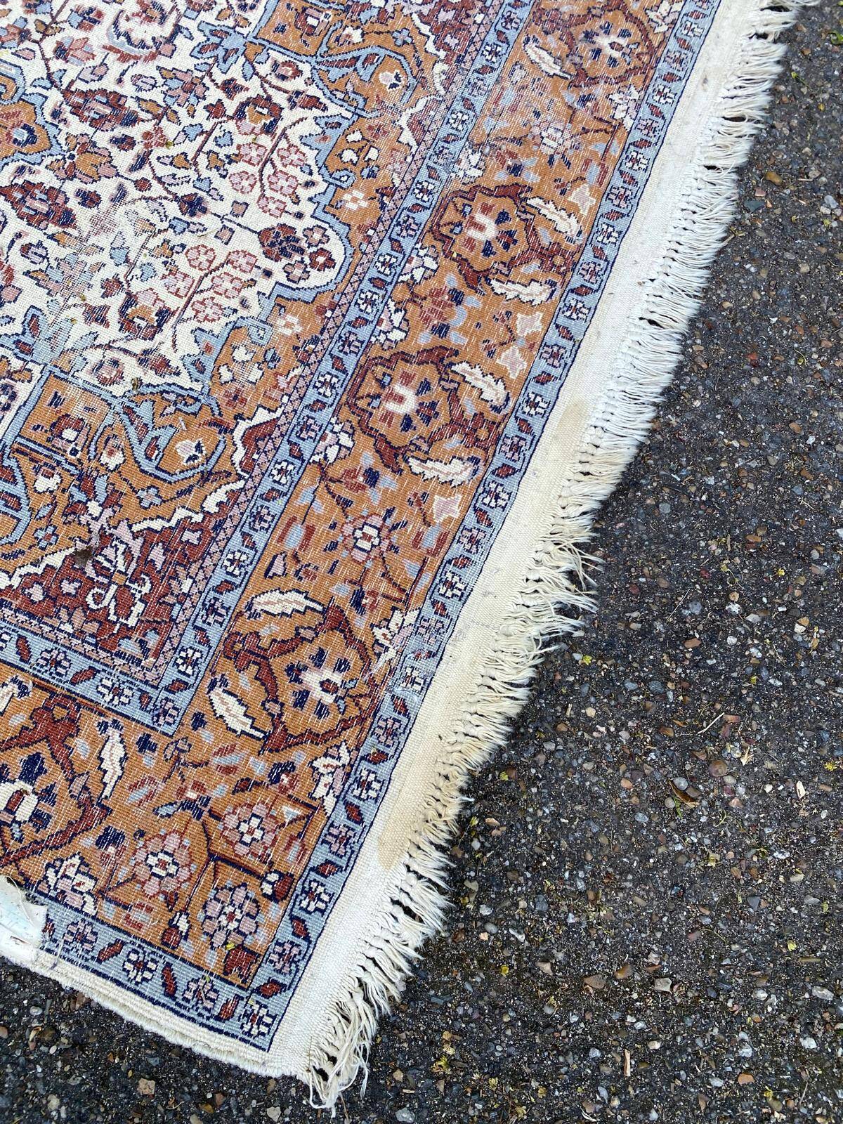 Handmade Persian rug in blue, beige, burgundy, and orange, 95x160cm.