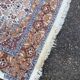 Handmade Persian rug in blue, beige, burgundy, and orange, 95x160cm.