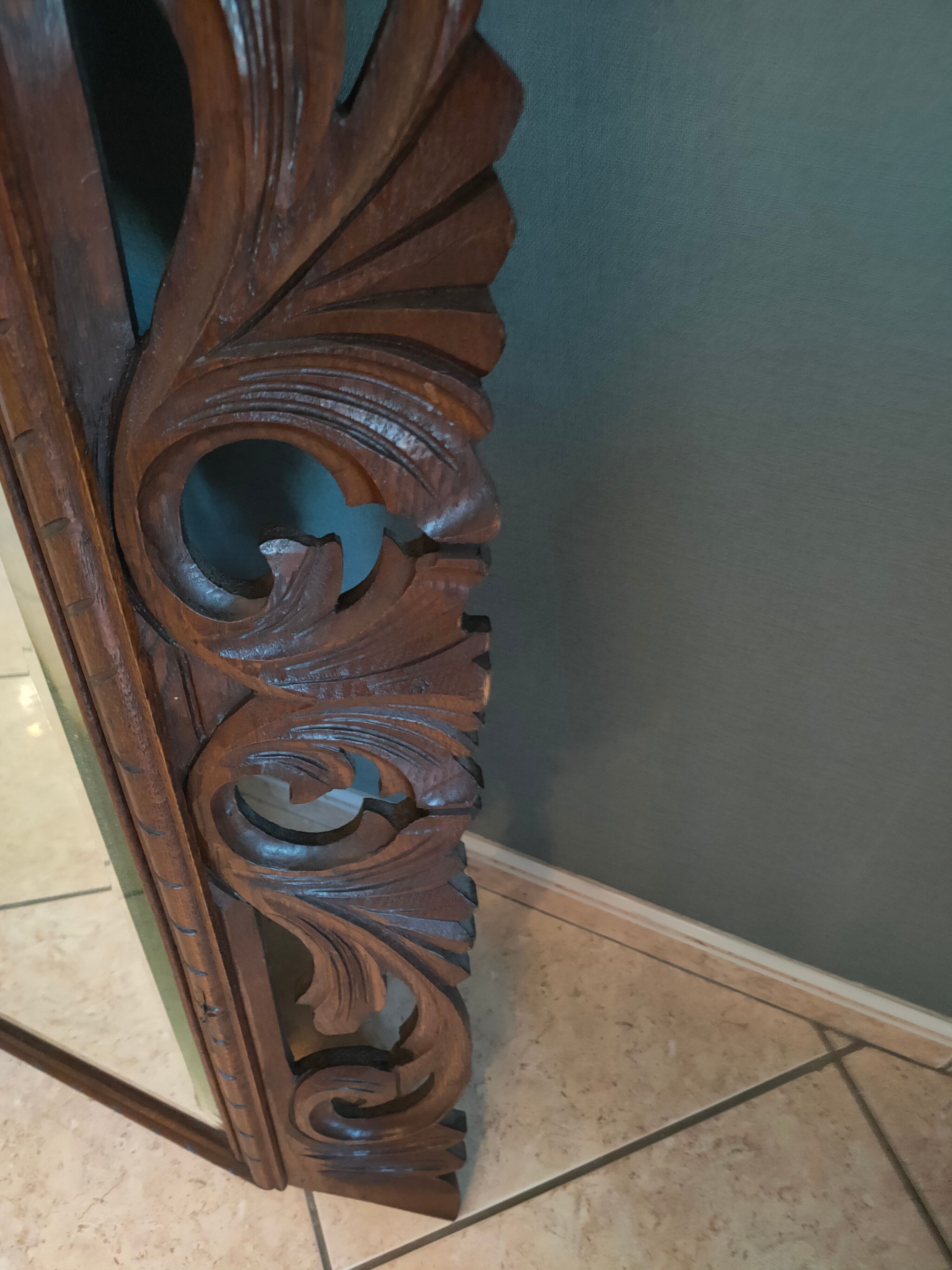 Antique mirror in openwork carved wood