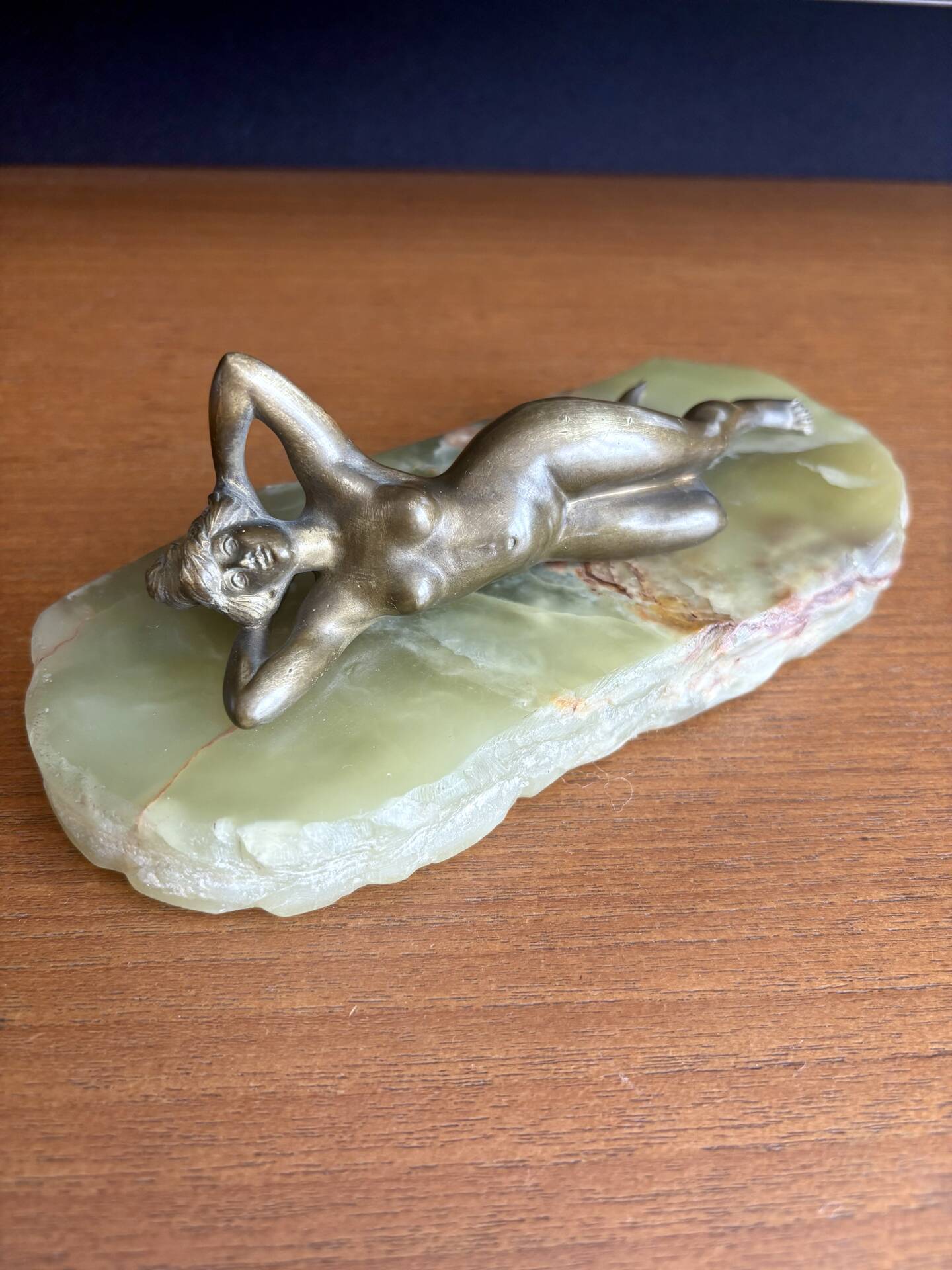 Art Deco female sculpture in bronze with onyx base.