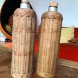Set of 2 old insulated bottles in braided wicker