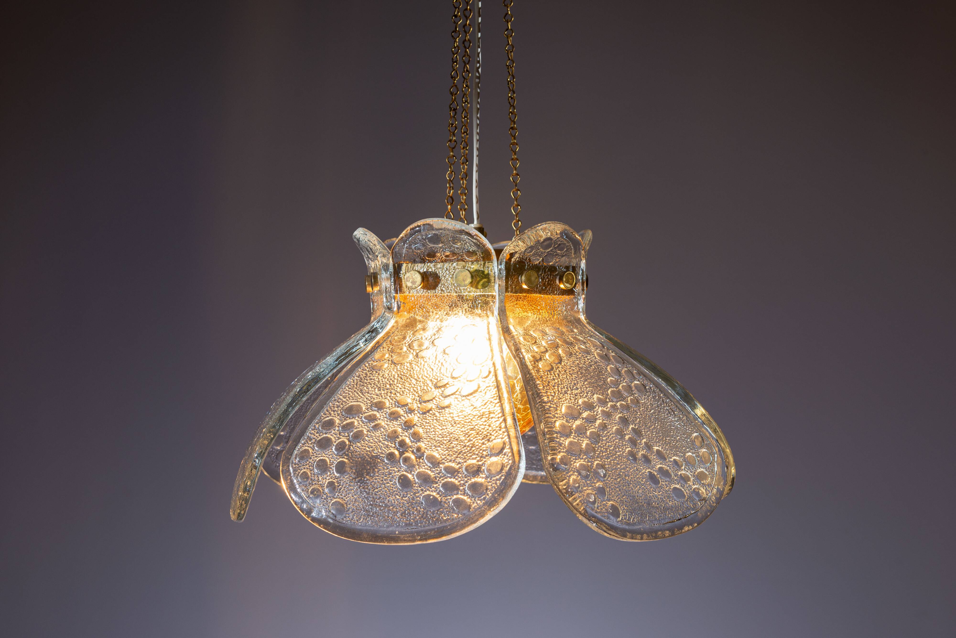 Swedish pendant with glass leaf shades and a center shade of amber coloured