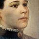 Oil on canvas portrait in an antique gilded wooden frame.