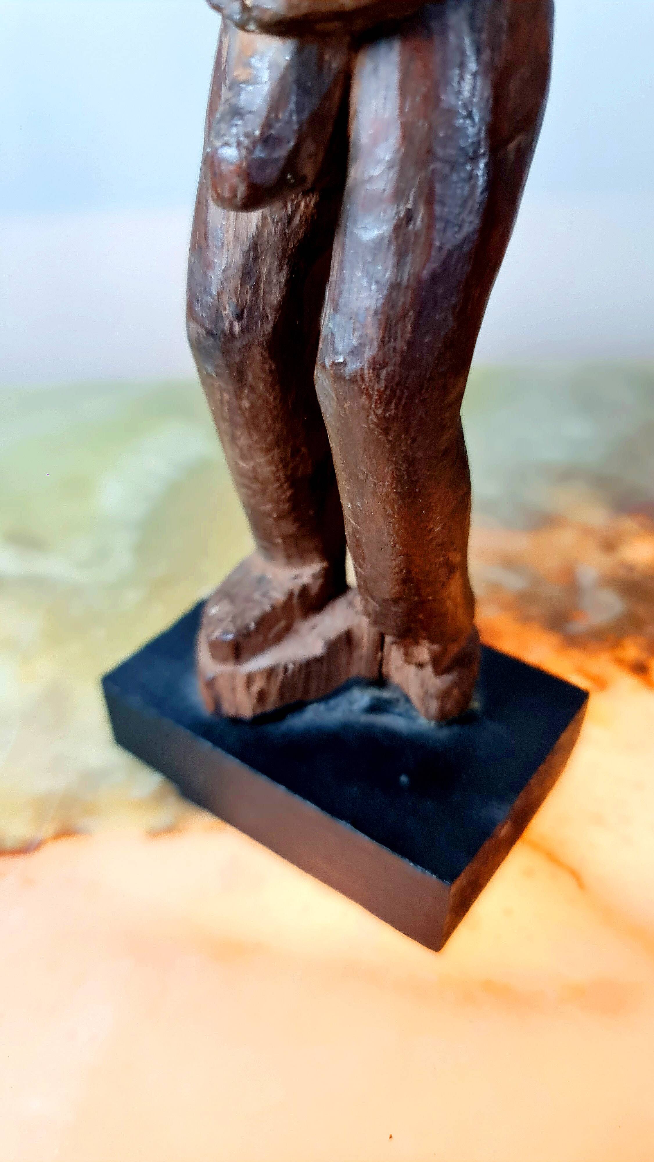 Old Fon statuette on a base, Benin