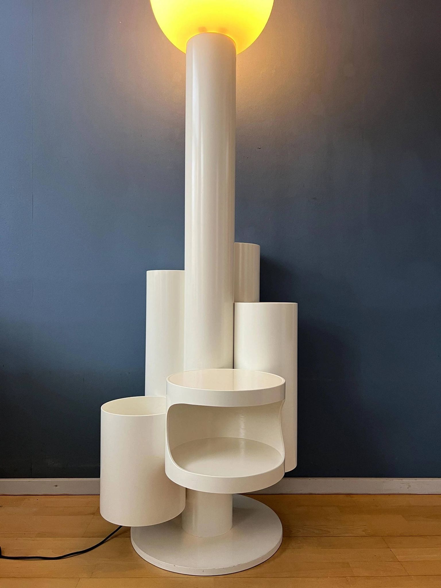 White floor lamp "Close Encounter" and plant stand by Kerst Koopman
