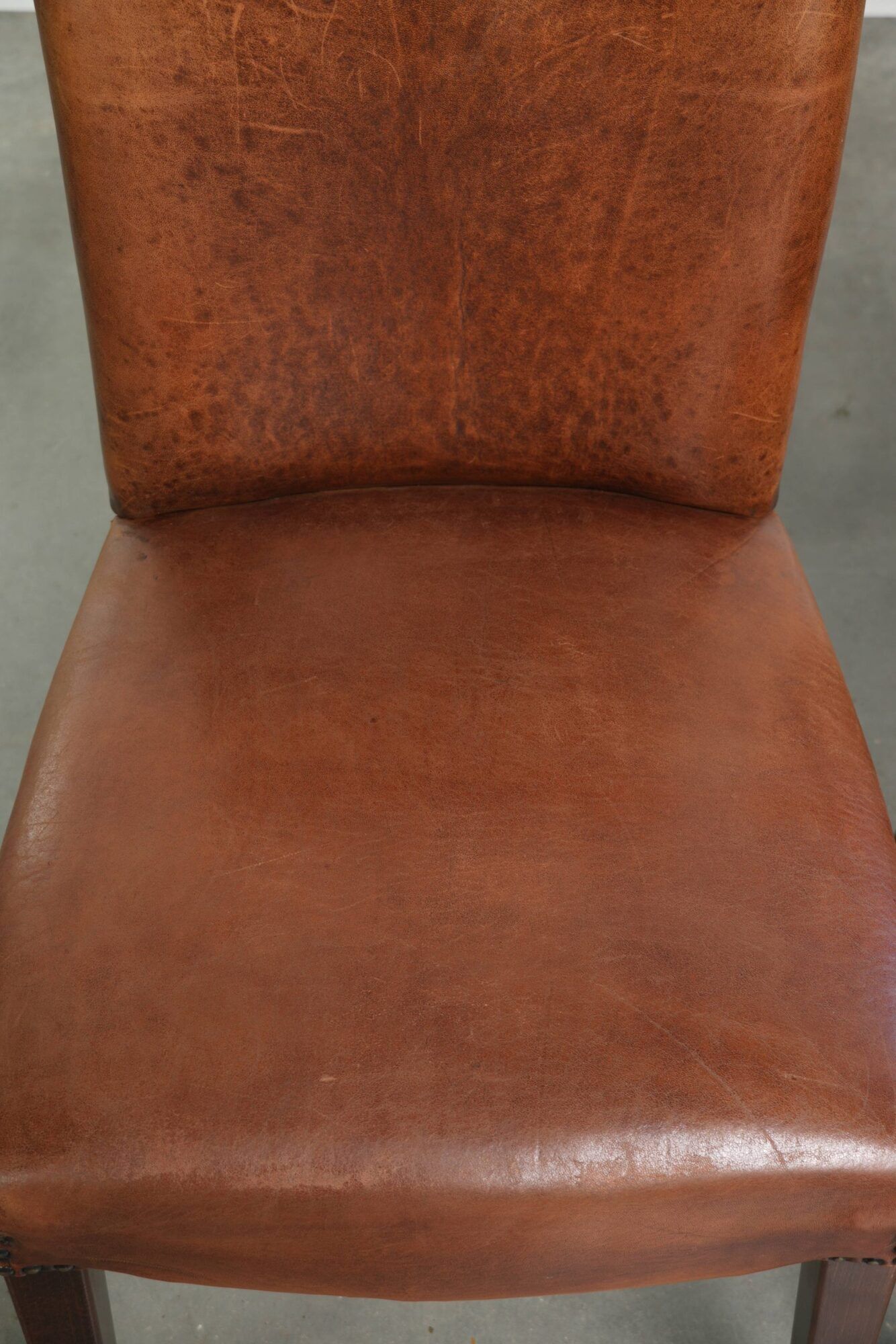 Set of 6 sheepskin dining chairs in a cognac colour with a lovely patina
