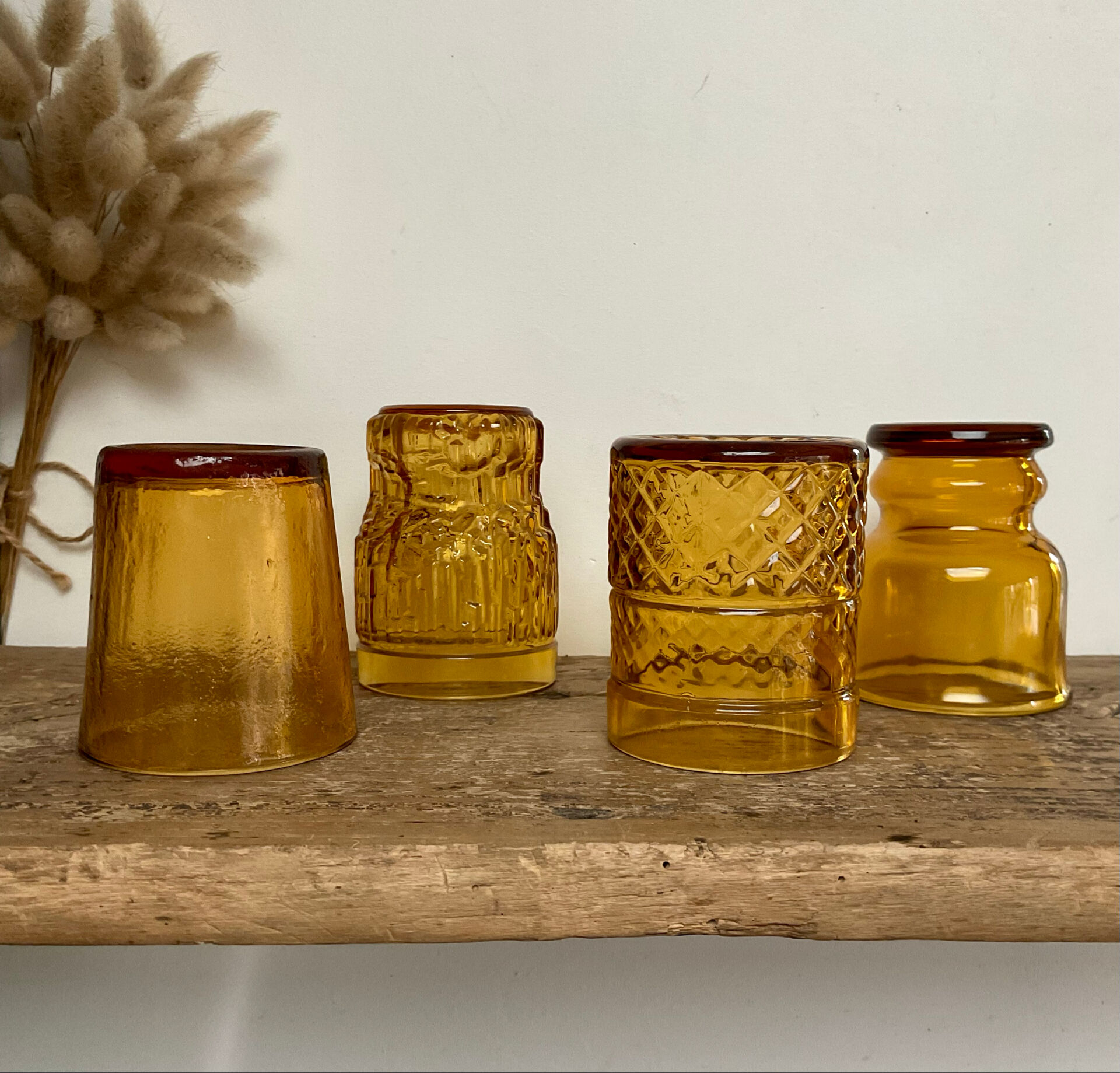 4 mismatched amber glasses