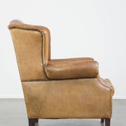 Patinated sheep leather wingback armchair