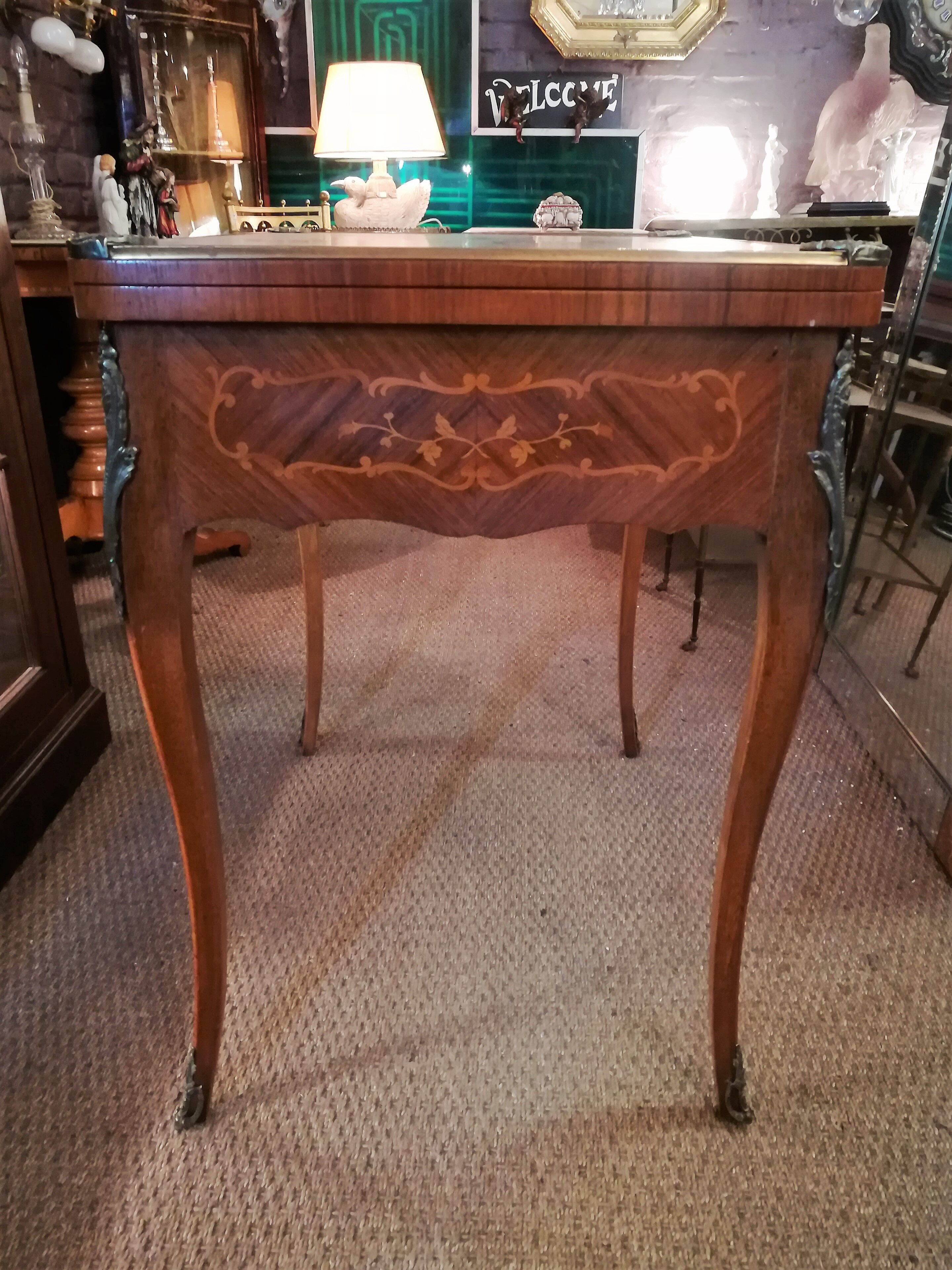 Louis XV style game table in marquetry