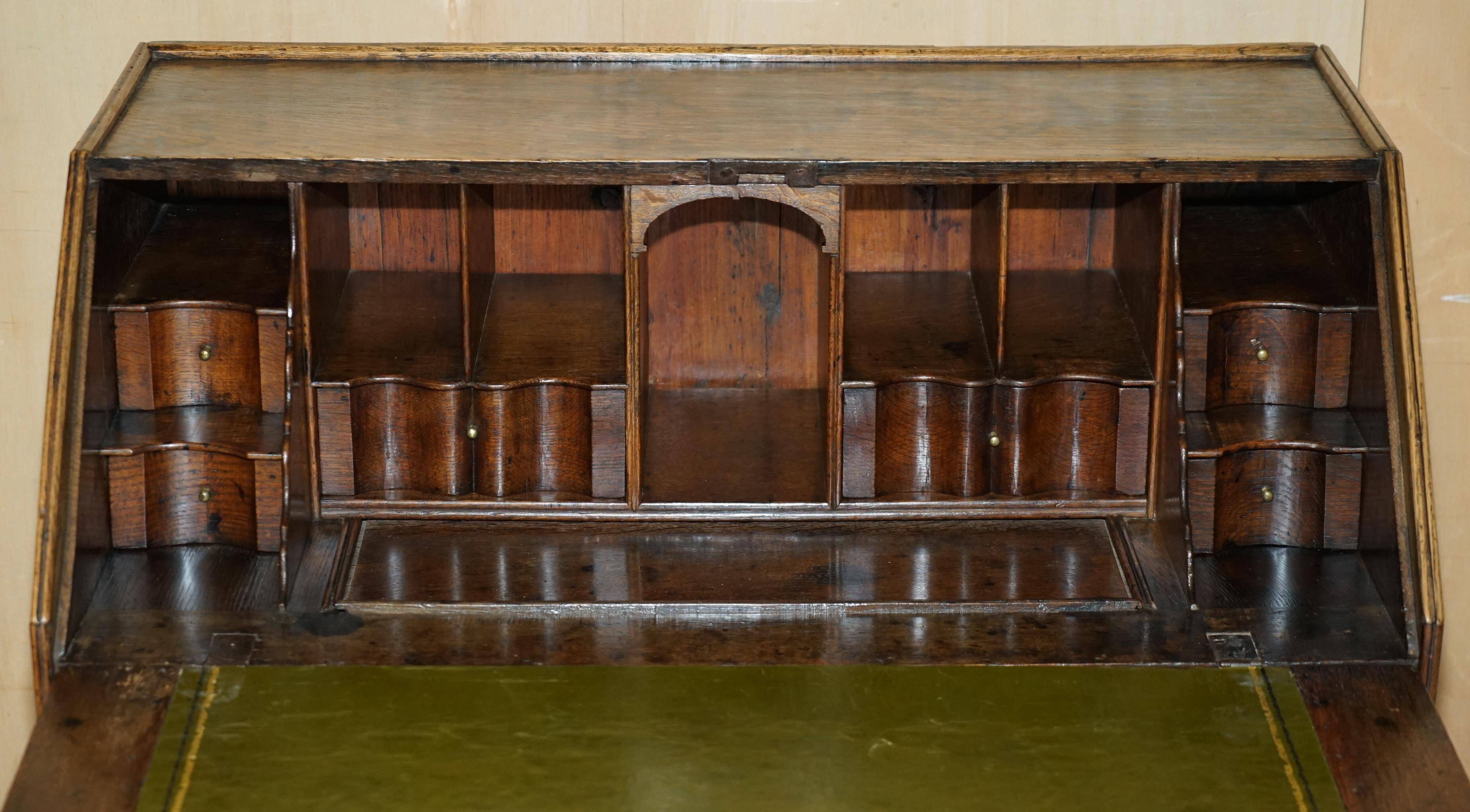 Ancient Georgian writing desk circa 1760 with a leather top.