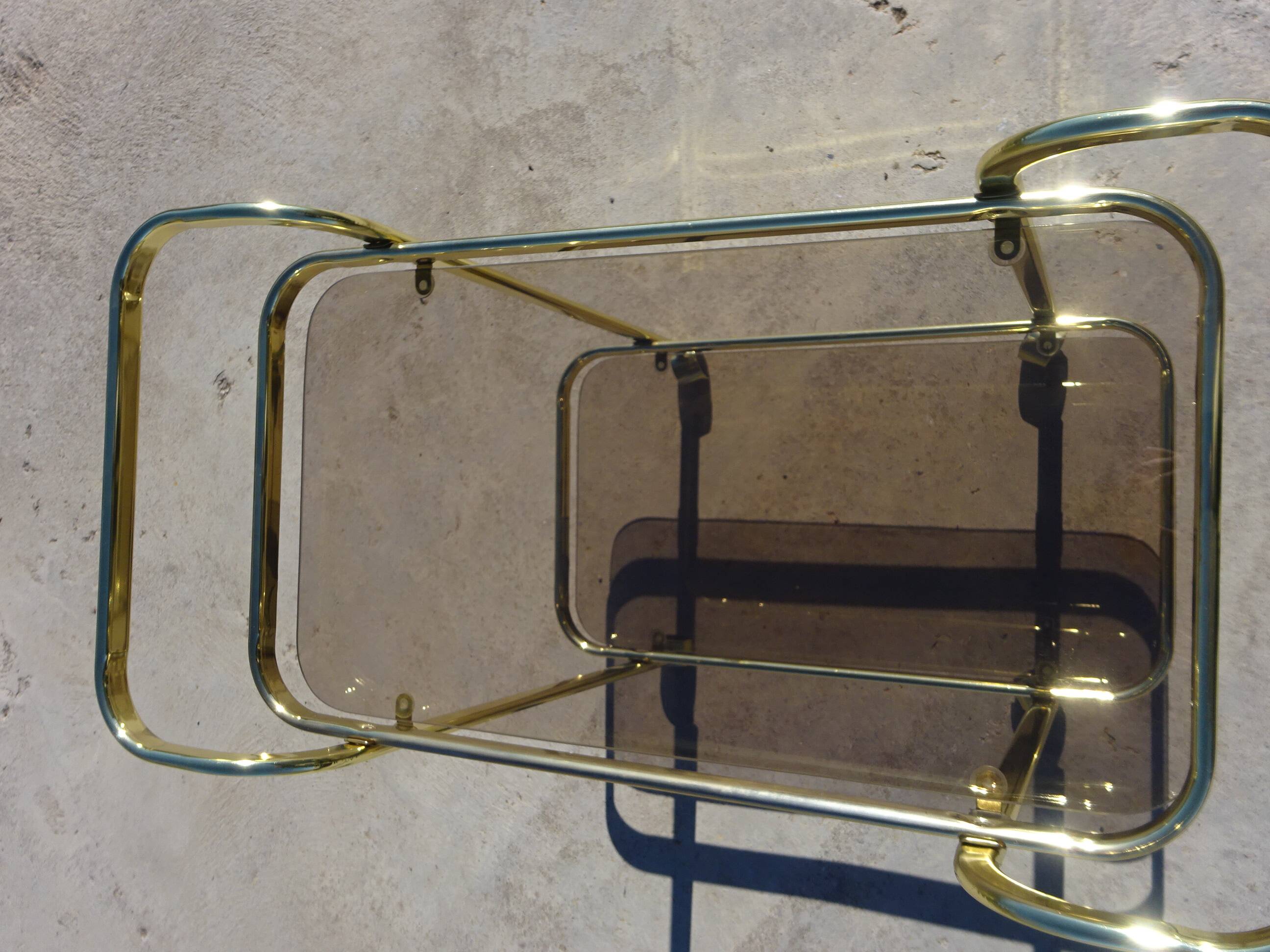 Golden metal and smoked glass dessert table