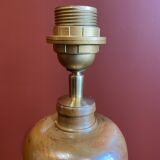 "Stoneware Bottle Lamp" with a multicoloured blue lampshade handwoven in India.