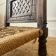 Traditional Indian low chair made of wood and rope.