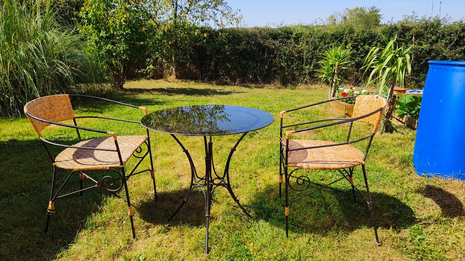 Garden table and wrought iron chair