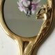 Miroir à main ovale en laiton