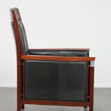 Black cowhide leather and wooden Art Deco design armchair