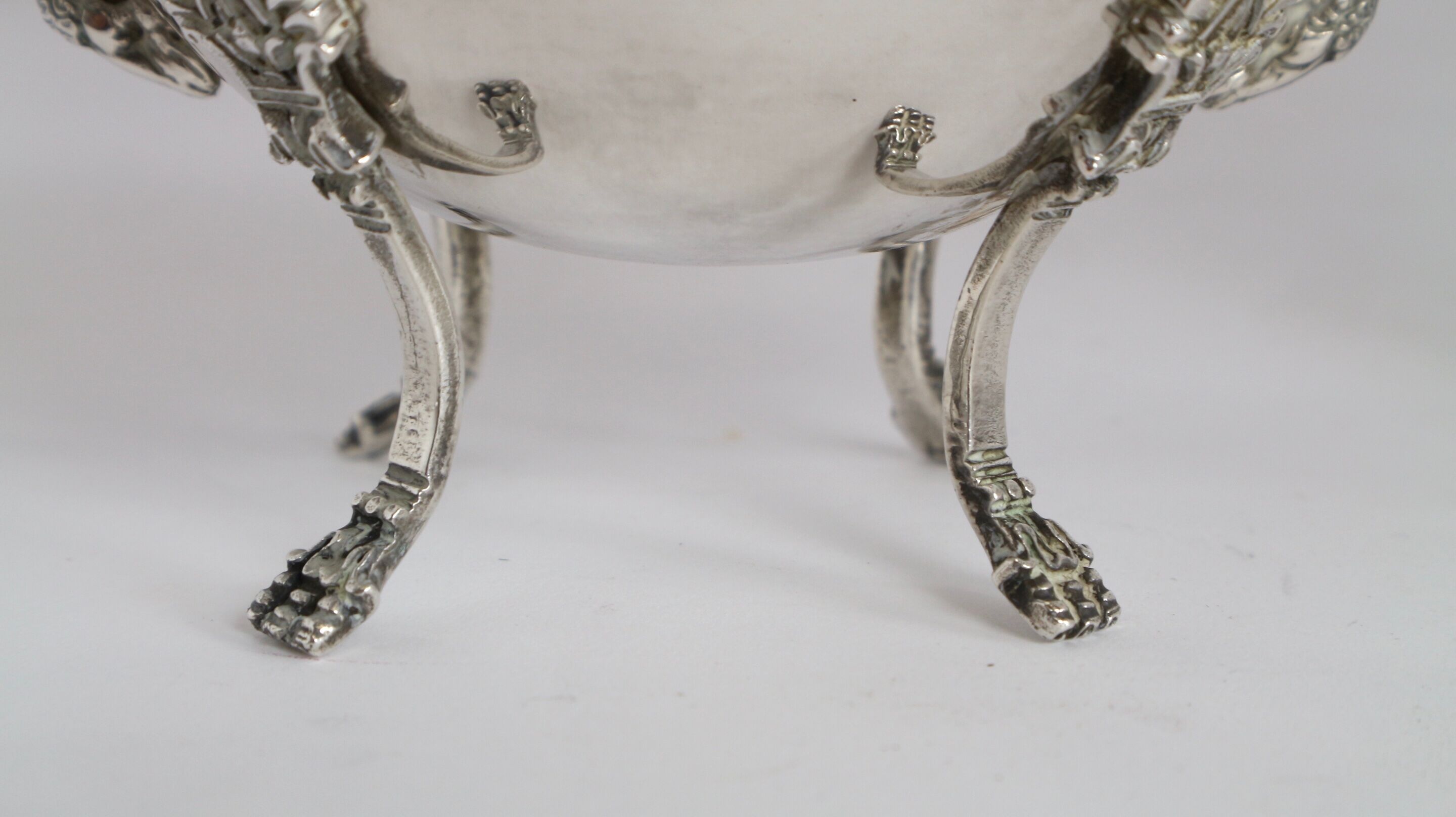 Silver sugar bowl with paw feet and ornate handles