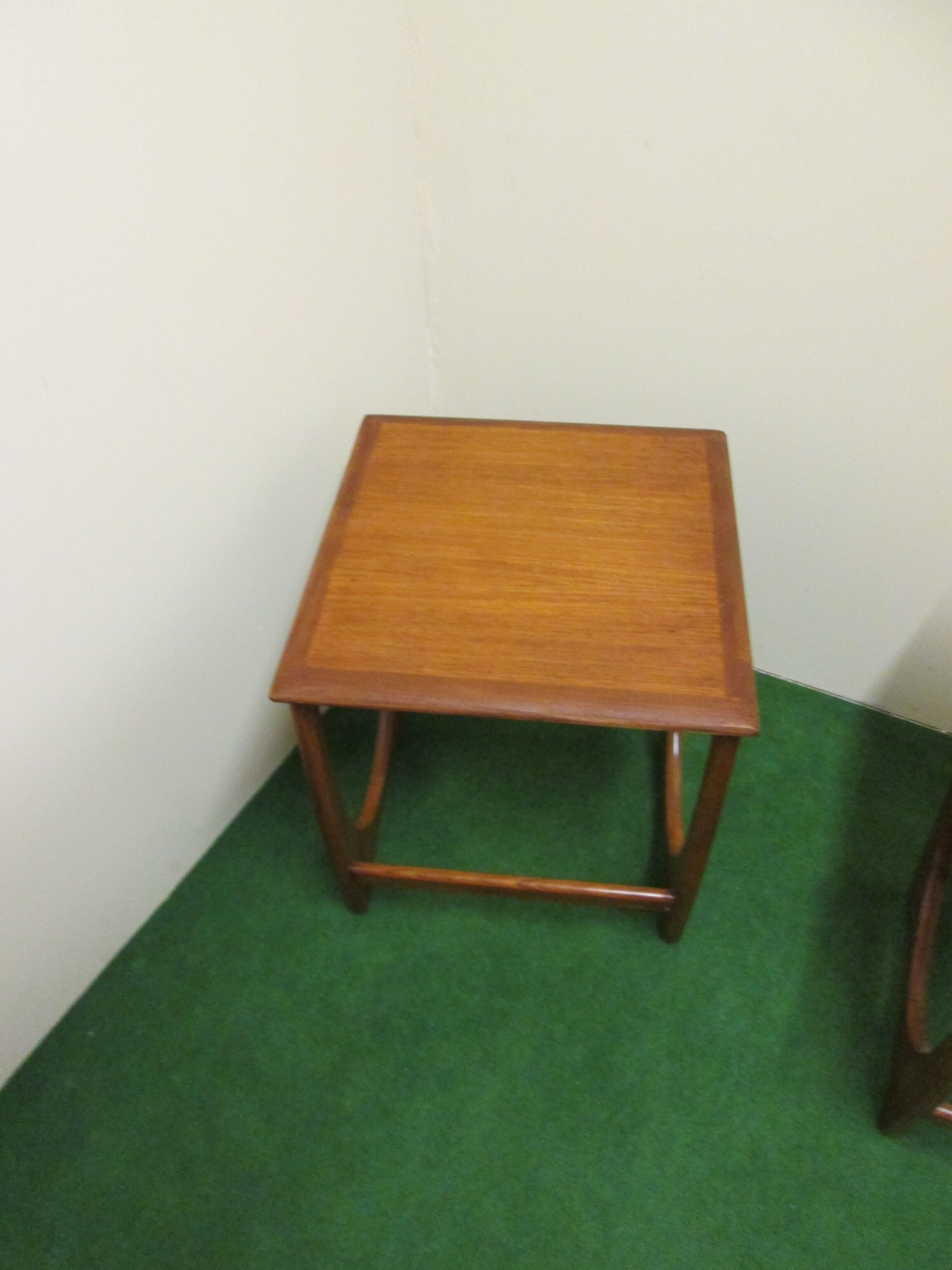 Nesting coffee tables in teak