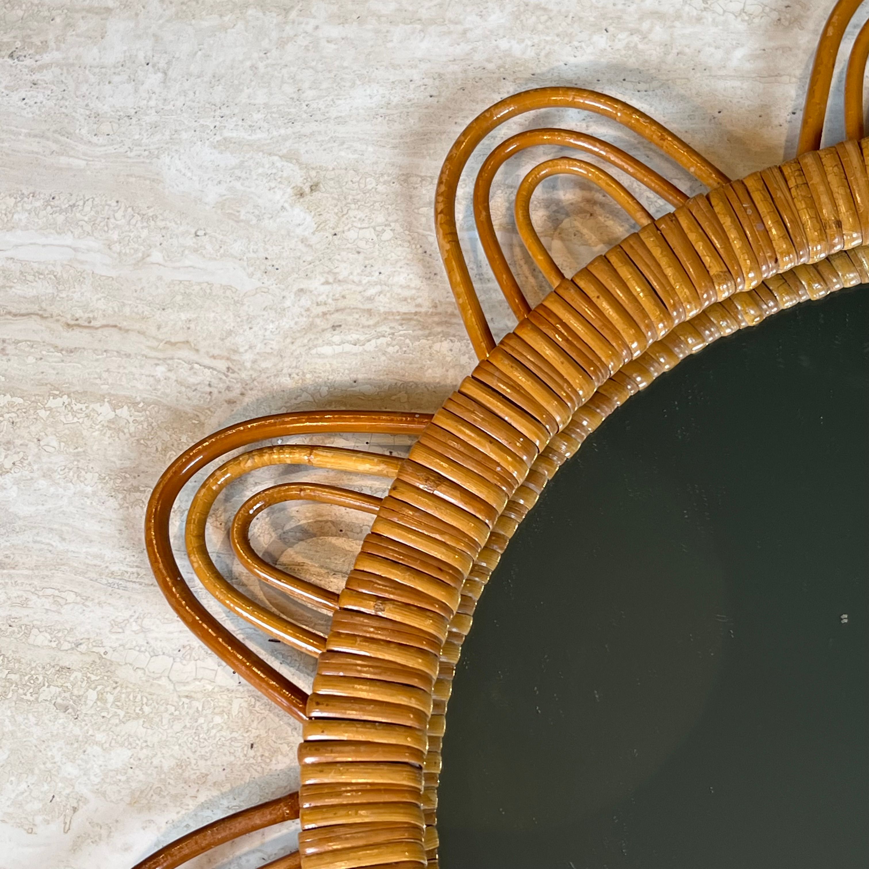 Rattan mirror representing a sun