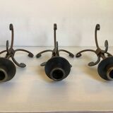 Trio of wrought iron candlesticks
