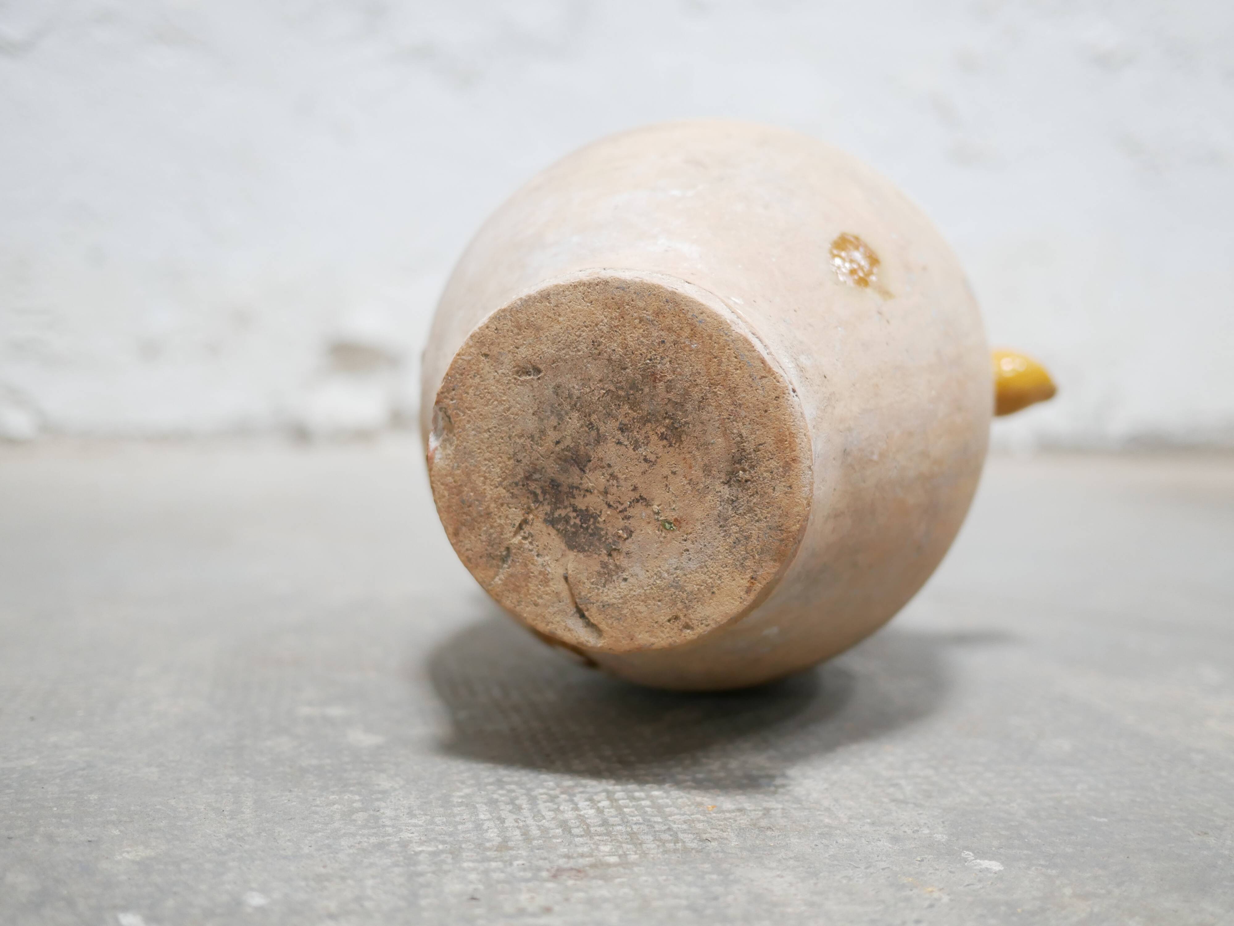 Old gargoulette pot in glazed terracotta